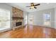 Bright living room featuring a large stone fireplace and hardwood floors at 604 Chadbourne Dr, Durham, NC 27703
