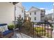 Serene view from the balcony overlooking a landscaped courtyard with seating and lush greenery at 605 Smedes Pl # B, Raleigh, NC 27605