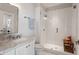 Elegant bathroom featuring marble countertop, a glass-enclosed shower, and modern fixtures at 605 Smedes Pl # B, Raleigh, NC 27605