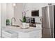 Well-lit kitchen with marble countertops, stainless steel appliances, and modern fixtures at 605 Smedes Pl # B, Raleigh, NC 27605