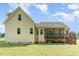 View of the home's back exterior, showing a deck and screened-in porch at 70 Breadnut Dr, Smithfield, NC 27577