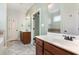 Bathroom boasting double sink vanity with granite countertops, tiled floors, and a relaxing tub at 70 Breadnut Dr, Smithfield, NC 27577