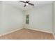Bedroom featuring plush carpeting, neutral paint, ceiling fan, and window with a view at 70 Breadnut Dr, Smithfield, NC 27577