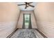 Unique bedroom with white wood walls, a ceiling fan, and view to backyard at 70 Breadnut Dr, Smithfield, NC 27577