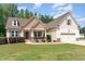 Attractive two-story home with a well-maintained lawn and inviting front porch at 70 Breadnut Dr, Smithfield, NC 27577