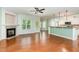 Open-concept living room featuring a cozy fireplace and hardwood floors at 70 Breadnut Dr, Smithfield, NC 27577