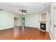 Bright living room featuring hardwood floors and a fireplace at 70 Breadnut Dr, Smithfield, NC 27577