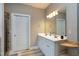 Bathroom featuring a double vanity with a large mirror and a doorway to the shower at 773 Rebecca Ln, Siler City, NC 27344