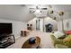 Attic living room with gray walls, carpet, ceiling fan, comfortable seating and a study area at 773 Rebecca Ln, Siler City, NC 27344