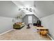 Attic living room with gray walls, carpet, ceiling fan and comfortable seating area at 773 Rebecca Ln, Siler City, NC 27344