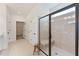 Bright bathroom with a glass shower enclosure and tiled floors at 86 Olivia Crossing Ct # 3, Four Oaks, NC 27524