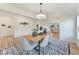 A charming dining room featuring a wooden table, stylish chairs, and a decorative rug and light fixture at 86 Olivia Crossing Ct # 3, Four Oaks, NC 27524