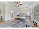 Tranquil main bedroom with tray ceilings, shiplap accent wall, en suite bathroom, and stylish decor at 86 Olivia Crossing Ct # 3, Four Oaks, NC 27524