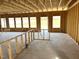 Large unfinished room with ample natural light from multiple windows, perfect for customization at 86 Olivia Crossing Ct # 3, Four Oaks, NC 27524