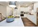 Modern kitchen featuring pendant lighting, white cabinets, and stainless steel appliances at 921 Thimbleweed Way, Wake Forest, NC 27587
