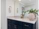 Bathroom vanity with blue cabinetry, granite countertop, and stylish fixtures at 95 Great Smoky Pl, Lillington, NC 27546