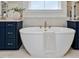 Luxurious bathroom featuring a sleek freestanding tub and elegant fixtures at 95 Great Smoky Pl, Lillington, NC 27546