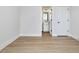 Bedroom leading to a modern bathroom with a doorway and a white door at 95 Great Smoky Pl, Lillington, NC 27546
