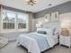 Bright bedroom with large windows, cozy decor, and ample natural light at 95 Great Smoky Pl, Lillington, NC 27546