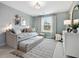 Charming bedroom with trundle bed, stylish decor and natural light from the window at 95 Great Smoky Pl, Lillington, NC 27546