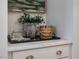 Dry bar with marble countertops, an elegant display of glassware and woven ice bucket at 95 Great Smoky Pl, Lillington, NC 27546