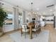 Open concept dining area with views into the living room and kitchen at 95 Great Smoky Pl, Lillington, NC 27546