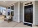 Welcoming front door with sidelight and covered porch at 95 Great Smoky Pl, Lillington, NC 27546