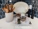 Close-up of the kitchen countertop with decorative accessories and a stylish tile backsplash at 95 Great Smoky Pl, Lillington, NC 27546