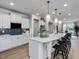 Bright kitchen featuring a large island, bar stool seating, and pendant lights at 95 Great Smoky Pl, Lillington, NC 27546