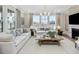 Inviting living room with fireplace, large windows and comfortable seating with stylish decor at 95 Great Smoky Pl, Lillington, NC 27546