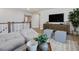 Relaxing living room with modern furnishings and entertainment center, creating an inviting space at 95 Great Smoky Pl, Lillington, NC 27546