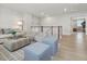 Bright, modern living area featuring stylish seating, decor and hardwood floors at 95 Great Smoky Pl, Lillington, NC 27546