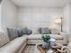 Cozy living room with a stylish sectional sofa, decorative pillows, and a modern lamp at 95 Great Smoky Pl, Lillington, NC 27546