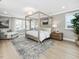Spacious bedroom with a four poster bed, natural light, and a tranquil ambiance at 95 Great Smoky Pl, Lillington, NC 27546