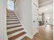Elegant staircase with wood treads leading to the upper level at 95 Great Smoky Pl, Lillington, NC 27546