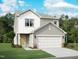 Charming two-story home featuring a two-car garage, light yellow door and neutral siding at 1124 Solace Way, Rolesville, NC 27571