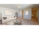 Cozy upstairs living room with neutral tones, comfortable seating, and a view of the hallway at 1157 Solace Way, Rolesville, NC 27571