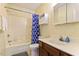 Bathroom featuring a tub and shower combination, vanity with sink, and storage at 124 Friar Ln, Carrboro, NC 27510