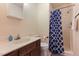 Bathroom with a shower and tub, toilet, vanity with sink and mirrored medicine cabinet at 124 Friar Ln, Carrboro, NC 27510
