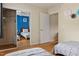 Spacious bedroom with hardwood floors, twin beds, closet with mirror doors at 124 Friar Ln, Carrboro, NC 27510
