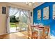 Bright dining area with sliding glass doors to the backyard and seating for four at 124 Friar Ln, Carrboro, NC 27510