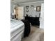 This bedroom features a comfortable bed, a black dresser, and a charming decor with a initial 'B' at 128 Madeline Ct, Youngsville, NC 27596