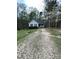 Charming single-story home with a gravel driveway and well-maintained landscaping at 128 Madeline Ct, Youngsville, NC 27596