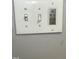 Modern light switch with fan and mood controls at 128 Madeline Ct, Youngsville, NC 27596