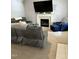 Comfortable living room with a fireplace and plush seating at 128 Madeline Ct, Youngsville, NC 27596