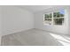 Bedroom featuring a bright window and neutral carpet at 132 Oat Grain Ct, Clayton, NC 27520