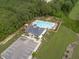 Aerial view of community amenities including a pool, clubhouse, and playground at 156 Greenhurst Cir, Holly Springs, NC 27540