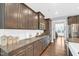 Gourmet kitchen with granite countertops, ample cabinetry, and stainless steel appliances at 156 Greenhurst Cir, Holly Springs, NC 27540