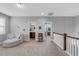 Spacious loft area with cozy seating and views into the bedrooms and bathrooms at 156 Greenhurst Cir, Holly Springs, NC 27540