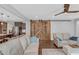 Comfortable living room with hardwood floors, cozy seating, and a rustic barn door at 156 Greenhurst Cir, Holly Springs, NC 27540